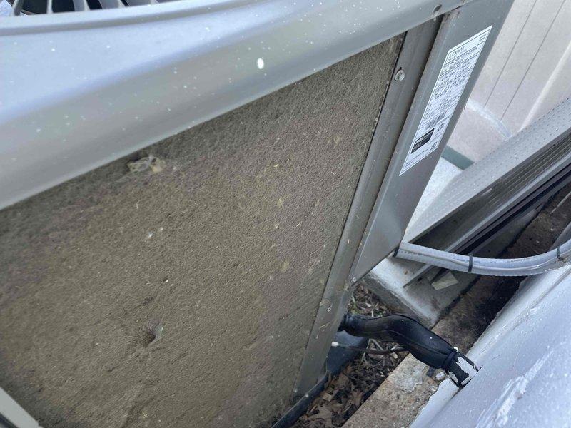 Completed comprehensive cooling system tune-up on single AC unit located in side yard. Performed standard maintenance procedures including inspection of internal components, filter assessment, and system evaluation. Unit showed significant filter contamination with heavy dust and debris accumulation requiring attention, and exterior housing displayed normal weathering consistent with outdoor exposure.