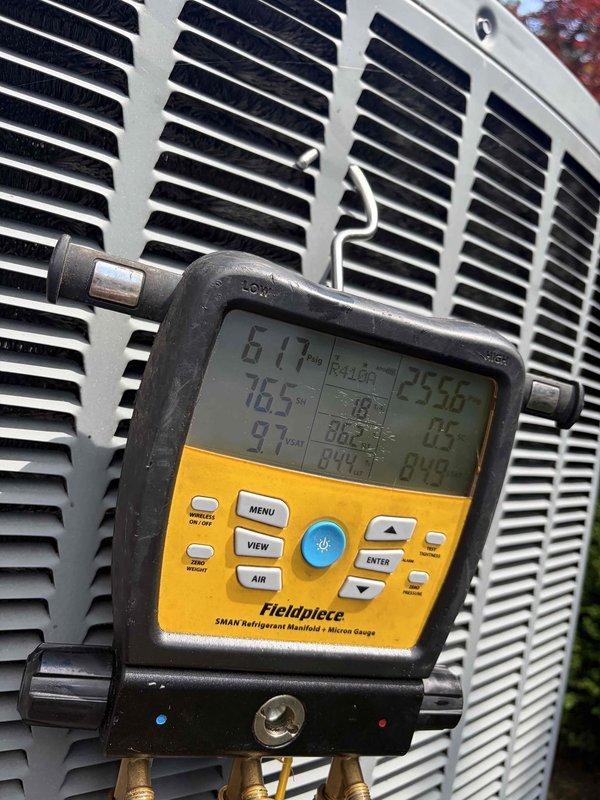 Responded to no cooling complaint on 10+ year old outdoor unit. Upon arrival, performed diagnostic testing using refrigerant manifold gauges to measure system pressures and temperatures. Readings indicated abnormal operating conditions with high-side pressure at 194.7 PSI and temperature differential showing 61°F and 255.6°F. Identified refrigerant system issue requiring repair, and customer was advised of findings and repair options.