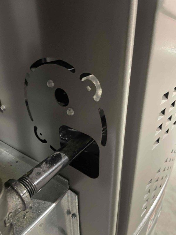Responded to service call for furnace cabinet with missing knockout plugs in basement unit under 10 years old. Upon inspection, identified multiple open knockout holes in the furnace cabinet that required sealing to maintain proper cabinet integrity and prevent potential safety issues. Installed appropriate knockout seals and plugs to close all open penetrations in the metal cabinet panels, ensuring the enclosure meets manufacturer specifications and code requirements. Verified all cabinet openings were properly secured and documented the completed repairs with photographs showing the installed hardware and sealed cabinet components.