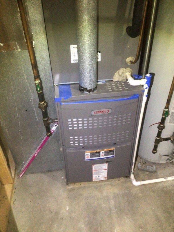 Responded to no cooling complaint on over 10-year-old Lennox system located in side yard. Customer reported system blowing warm air. Upon arrival, inspected outdoor condensing unit and indoor furnace equipment. Evaluated electrical connections at breaker panel and verified proper power supply to HVAC system. Advised customer to turn unit off and leave fan on to prevent further issues. Documented equipment condition and electrical panel configuration with photos for service records.