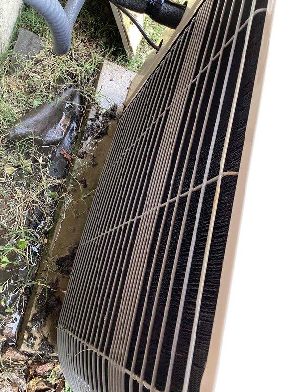 Completed cooling system tune-up on outdoor condenser unit over 10 years old. Performed standard maintenance inspection, noting heavily soiled condenser coil fins with significant debris accumulation and deteriorated condition requiring cleaning attention. Unit operational at time of service with electrical connections and refrigerant lines inspected per maintenance protocol.