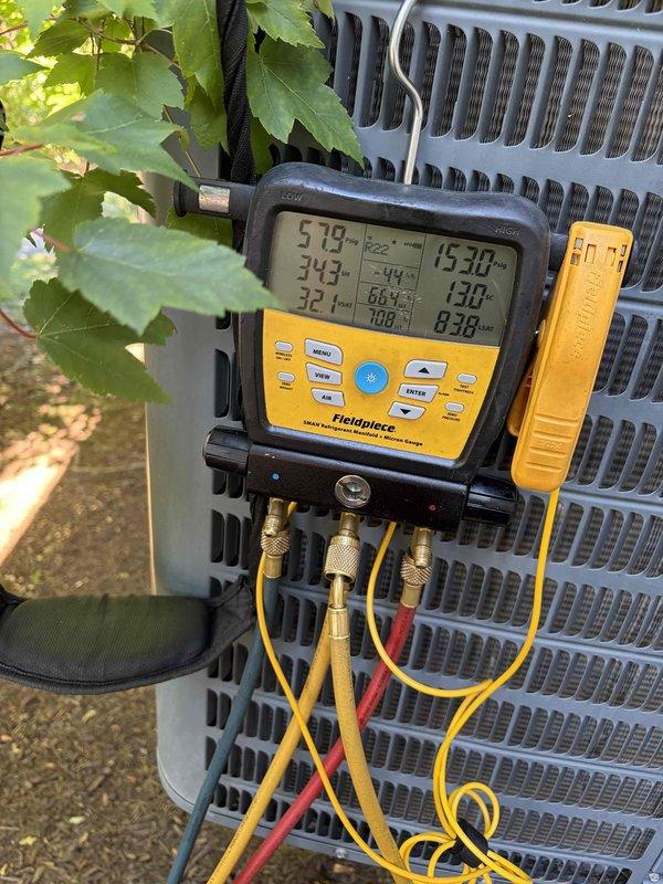 Responded to no cooling complaint on 10+ year old residential air conditioning unit located at side of house. Upon arrival, connected digital manifold gauges to service ports and evaluated system pressures and temperatures. Diagnostics revealed failed dual run capacitor preventing compressor and condenser fan motor from operating properly. Removed defective capacitor from electrical panel, installed new OEM-spec replacement capacitor, and secured all electrical connections with proper wire nuts. Verified correct microfarad ratings for both compressor and fan motor circuits. Started system and confirmed compressor and outdoor fan motor engaged properly. Monitored operating pressures and temperatures to ensure system returned to normal cooling operation with no further issues detected.