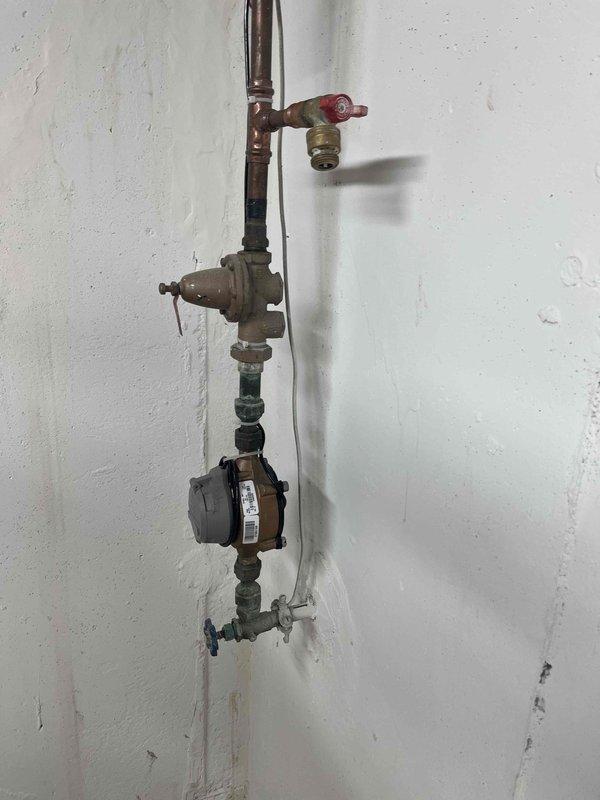 Installed a 40-gallon gas short water heater in basement to resolve no hot water condition. Connected all supply and discharge plumbing including expansion tank, installed proper venting, and applied permit sticker for permit #26PLU-12279. System tested and verified operational upon completion.