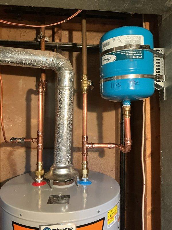 Installed a 40-gallon tall gas water heater to replace the existing unit that was experiencing continuous water discharge from the overflow tube. The new Ruud water heater was professionally installed with proper copper pipe connections, brass fittings, and valves, integrated with the existing blue expansion tank and plumbing system. All connections were soldered, tested for leaks, and verified for proper operation to resolve the overflow issue.