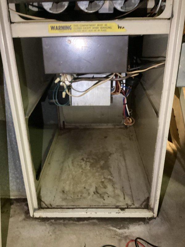 Completed comprehensive AC tune-up on single outdoor unit located in side yard. Performed standard maintenance protocol including inspection of electrical components, transformer, and wiring connections within cabinet. Unit is original equipment approximately 58 years old, showing age-related wear and dust accumulation in electrical compartment. Cleaned and serviced accessible components, verified proper operation of all systems. Custom-cut filter material installed in furnace per specifications due to non-standard sizing requirements of original equipment. All safety checks completed and unit returned to normal operation.