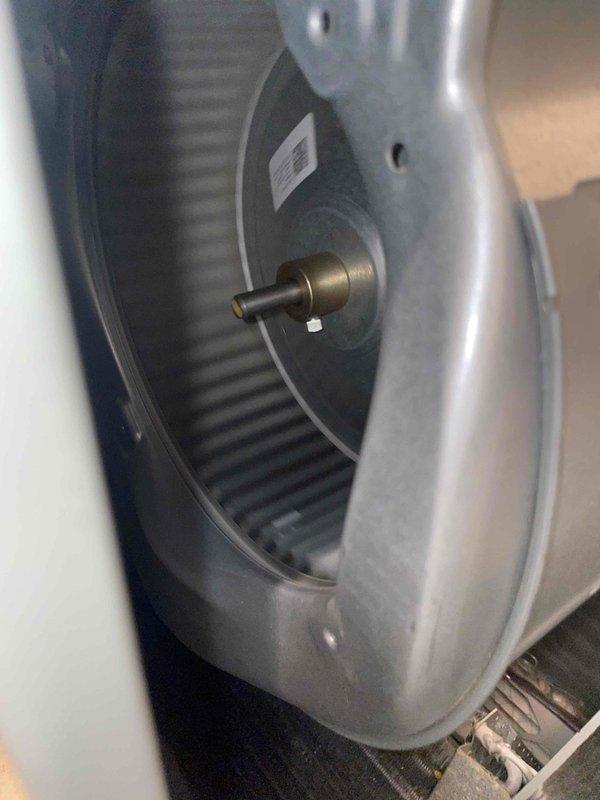 Responded to no cooling complaint on U10 unit located at side of home. Upon arrival, found system had been shut off. Performed diagnostic inspection of indoor air handler components, examining blower wheel assembly and air filtration system. Blower wheel showed normal condition with intact curved blades and proper motor shaft alignment. Air filter inspected and found to be in serviceable condition with clean mesh pattern and no significant debris accumulation. Housing and internal components appeared well-maintained with no visible signs of mechanical failure or obstruction.