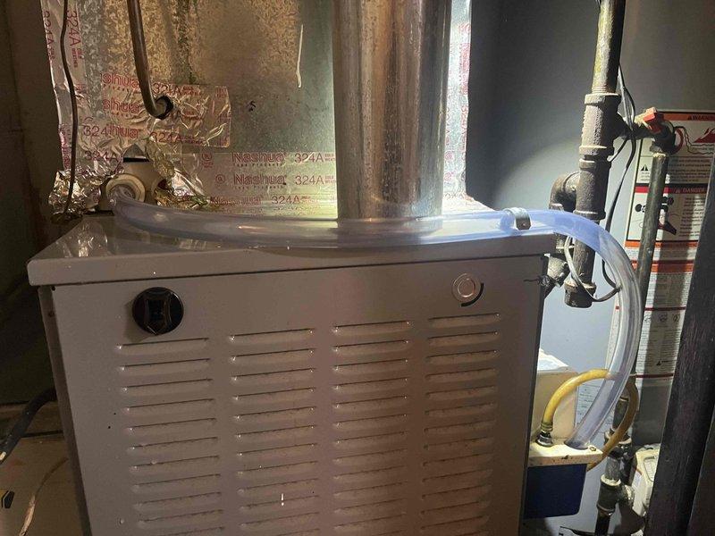 Responded to reported HVAC system leak on a unit under 10 years old. Upon inspection, accessed the furnace cabinet and examined internal components including the blower assembly, control board, and associated ductwork. Identified the source of the leak related to the humidifier system mounted on the unit. Inspected all water supply lines, drain connections, and humidifier pad assembly for signs of moisture infiltration. Performed necessary repairs to eliminate the leak, verified proper drainage, and tested the system for proper operation. Documented the internal condition of the equipment with photos showing the blower housing, control wiring, humidifier installation, and connection points to ensure all components were functioning correctly and no further water intrusion was present.