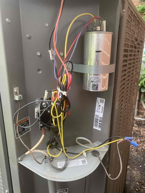 Completed comprehensive tune-up and maintenance service on two HVAC systems consisting of one upflow indoor unit and one outdoor condensing unit, both approximately ten years old. Performed standard preventative maintenance procedures including inspection of electrical connections, capacitor testing, blower motor assembly examination, and verification of proper wire terminations on both systems. Documented equipment condition with detailed photography showing capacitor, contactor, blower assembly, and electrical components; all systems found to be in operational condition with components functioning within normal parameters and properly secured.