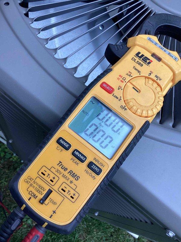 Responded to no cooling complaint on residential HVAC unit located on side of home. Performed diagnostic evaluation using digital multimeter to measure electrical values and system performance parameters. Unit assessed for cooling efficiency issues, with customer reporting air not as cold as expected and requesting potential cleaning service.