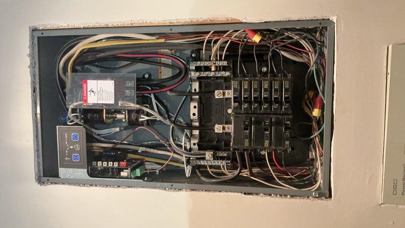 Responded to service call for AC unit not working and loss of power to master bathroom, bedroom, and wine cooling unit following multiple tripped breakers. Upon arrival, performed comprehensive electrical panel inspection and testing using clamp meter to measure current loads on affected circuits. Investigation revealed underlying issues with panel electrical supply and distribution system. Documented panel condition with photographs showing circuit breaker configuration, wire connections, bus bars, and terminal blocks. Measured circuit loads showing 23.1 amp reading on tested breaker. Identified compromised connections and potential overload conditions affecting multiple branch circuits. Advised that panel requires further electrical repairs to restore safe operation to affected areas and recommended comprehensive evaluation of electrical distribution system to address root cause of breaker trips and power loss.