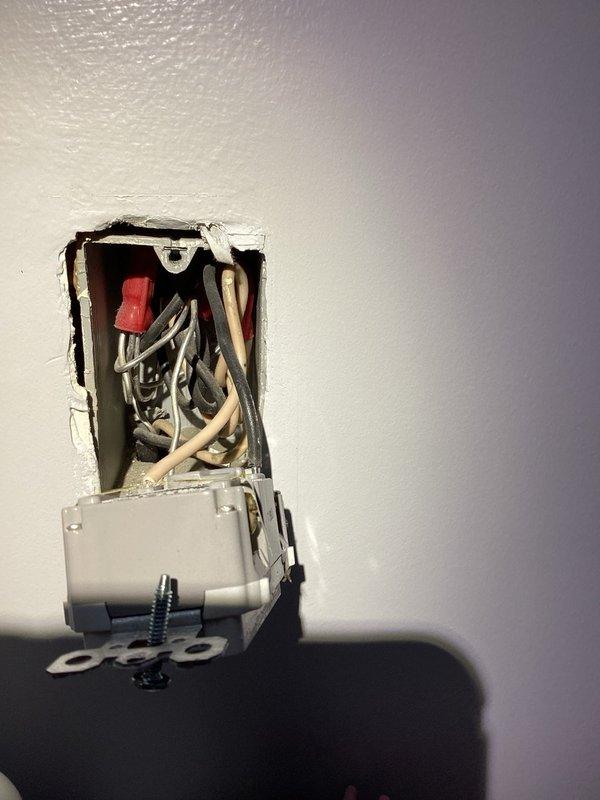 Completed comprehensive whole home electrical inspection. Inspected multiple outlets throughout the residence, including receptacles in drywall and tiled areas. Identified loose outlet installations requiring securing to junction boxes and verified wire connections including hot, neutral, and ground conductors. Documented findings with photos showing exposed wiring and improperly mounted receptacles for future repair recommendations.