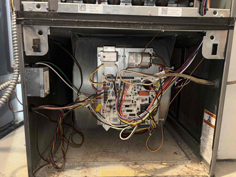 Completed comprehensive tune-up service on residential air conditioning system located in basement. Performed inspection of indoor air handler unit, accessing internal components including blower motors, control board, and electrical connections. Replaced pleated air filter and verified all wiring connections were secure and properly routed throughout the unit.