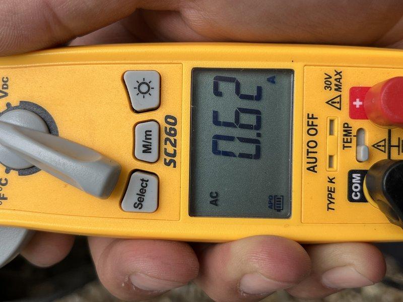 Performed comprehensive cooling system tune-up on single outdoor condensing unit. Upon inspection, found evaporator coil heavily soiled with accumulated debris, dust, and organic matter restricting airflow. Removed top panel to access coil assembly, documented condition with photos, and verified electrical readings using digital multimeter. Cleaned coil fins, removed debris buildup, and inspected refrigerant lines showing normal weathering patina consistent with unit age.