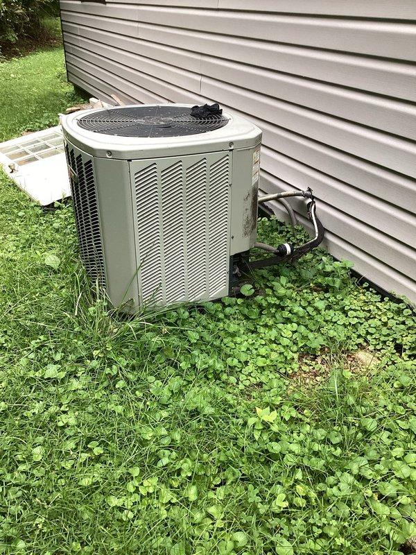 Responded to service call for HVAC system and water heater assessment following reported flood damage. Performed visual inspection of outdoor condenser unit and basement mechanical systems to evaluate operational status and extent of water damage. Documented current condition of equipment including condenser unit, ductwork, water heater, and associated plumbing infrastructure to confirm system functionality concerns.