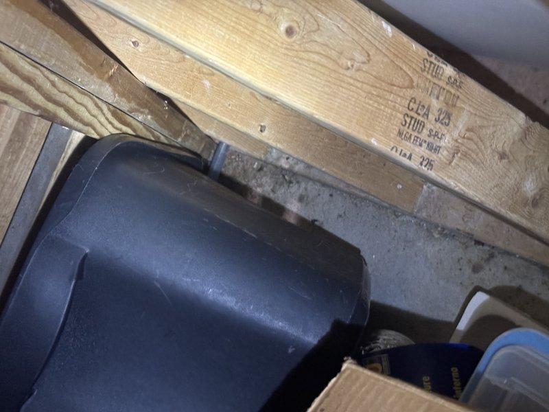 Responded to report of water pooling near furnace in basement. Upon arrival, conducted thorough inspection of unit and surrounding area, including structural components and drainage systems. Documented conditions with photographs showing wooden floor joists, foundation walls, and stored materials in vicinity of HVAC equipment. Identified source of moisture accumulation and performed necessary repairs to resolve water leak issue.
