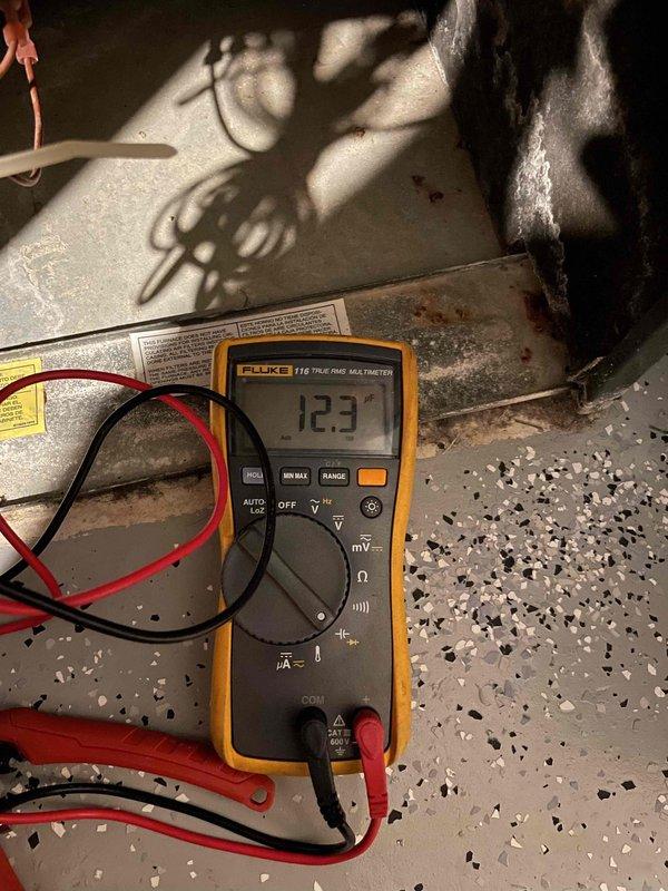 Completed comprehensive tune-up and maintenance service on a single 10-year-old residential air conditioning system. Performed visual inspection of outdoor condenser unit, verified proper electrical readings using calibrated multimeter showing 12.3 volts at measured points, inspected condenser coil condition through exterior grille, and confirmed unit accessibility and mounting stability on concrete pad. System found to be in functioning condition with all components operational per standard preventive maintenance protocol.
