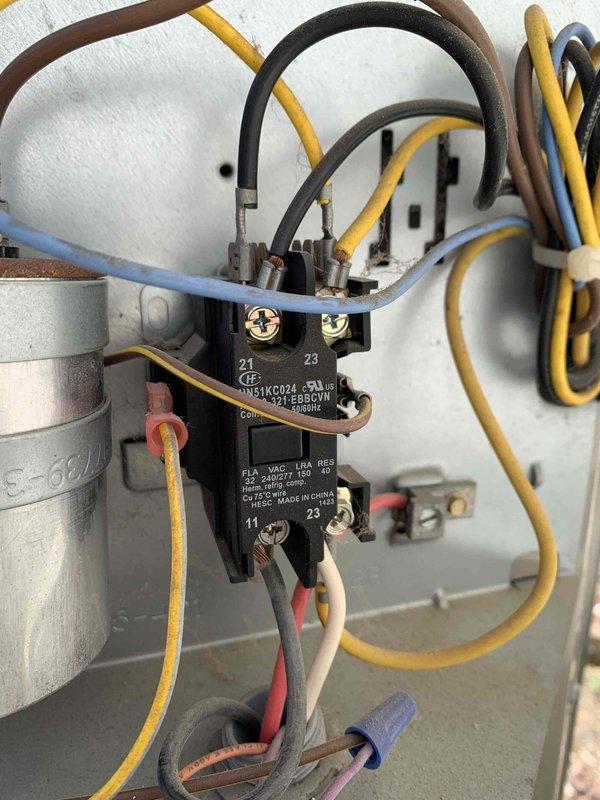 Installed SureSwitch contactor in HVAC unit to replace failed component. Accessed equipment using 6-8ft ladder, removed old contactor, and properly wired new White-Rodgers SureSwitch unit with all electrical connections including capacitor leads and control wiring. Verified proper operation of heating and cooling system, confirmed LED indicators showed normal cycle operation, and disposed of old part per protocol.