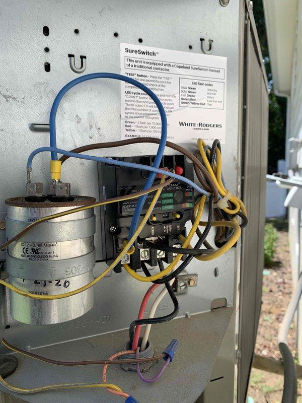 Installed SureSwitch contactor in HVAC unit to replace failed component. Accessed equipment using 6-8ft ladder, removed old contactor, and properly wired new White-Rodgers SureSwitch unit with all electrical connections including capacitor leads and control wiring. Verified proper operation of heating and cooling system, confirmed LED indicators showed normal cycle operation, and disposed of old part per protocol.