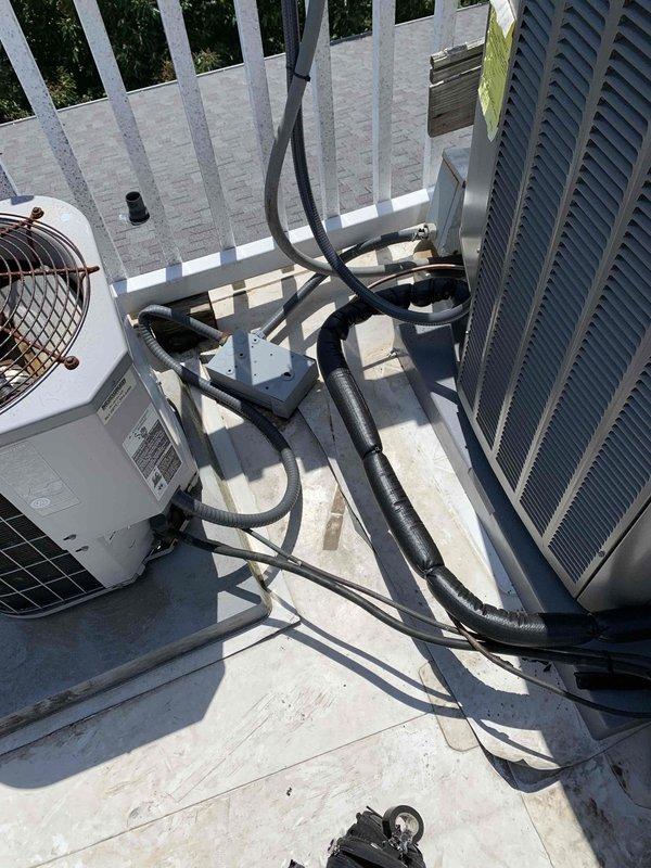 Responded to install callback for non-operational AC system displaying air handler fault and blower motor start fault error messages. Verified proper installation and operation of new S40 system including outdoor condensing unit, air handler with 9KW heat kit, new return base with 16x20 filter rack, drain pan, wet switch, electrical disconnect, and refrigerant line set. Cleared fault codes, confirmed system startup sequence, verified proper airflow and cooling operation, and documented completed installation with photos showing rooftop-mounted equipment properly secured with all components functioning as designed.