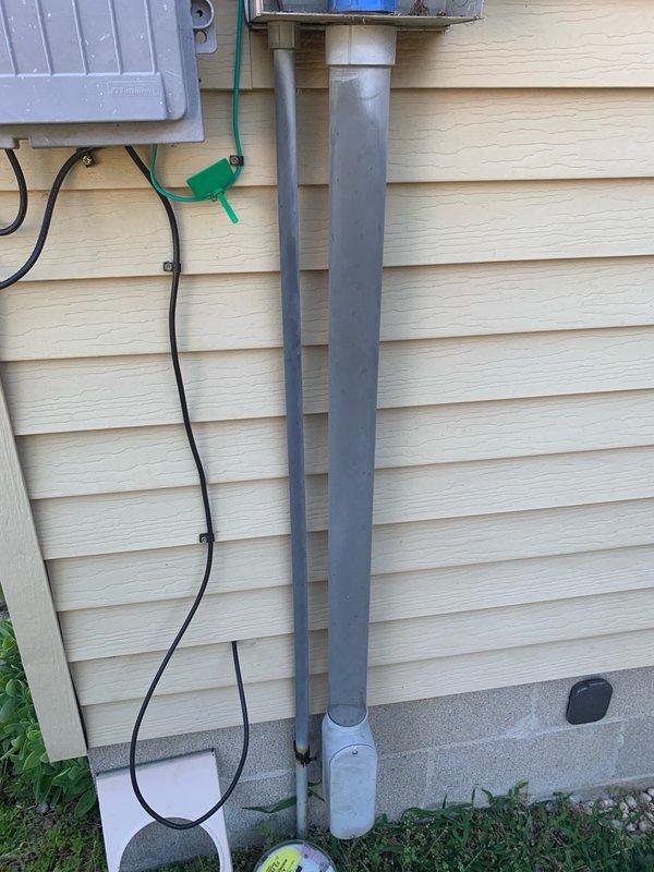 Installed new meter main combination panel on exterior wall of residence with integrated surge protection system. Ran metallic conduit vertically from panel to roofline connection point, securing all components to building siding per code requirements. Completed electrical service upgrade with proper grounding and weatherproof installation.