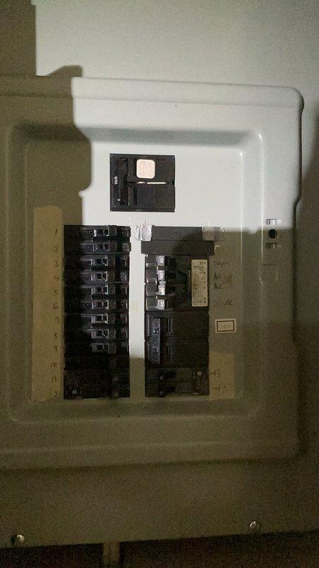 Conducted site evaluation of existing electrical service for panel upgrade estimate. Inspected exterior meter enclosure and interior main distribution panel containing combination breaker and fuse configuration, documenting current system condition with photographs to provide accurate replacement specifications and pricing for outdated fuse-based electrical panel.