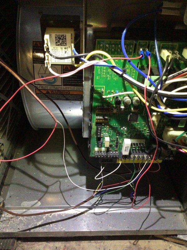 Completed comprehensive tune-up service on outdoor AC condenser unit. Performed thorough inspection of control board and electrical connections, verified proper wiring configuration and component operation. Cleaned condenser coils showing algae buildup on exterior fins, inspected fan assembly and top grille for proper operation, and confirmed unit is operating within normal parameters on concrete pad with adequate clearance.