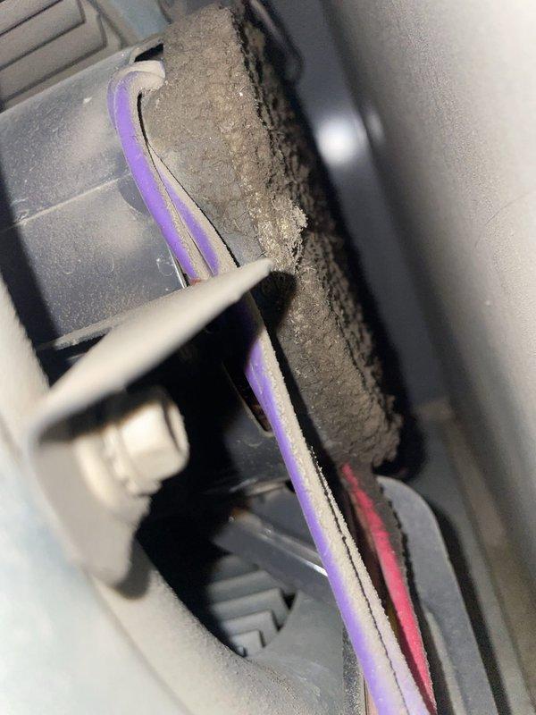 Responded to complaint of loud humming noise from indoor air handler unit lasting approximately 30 seconds before system startup. Upon inspection, discovered blower motor assembly and surrounding components with significant dust and debris accumulation affecting normal operation. Documented equipment condition with photos showing excessive particulate buildup on motor housing, cooling fins, and electrical connections. Identified dust accumulation as contributing factor to delayed startup and abnormal operational sounds from the 2020-installed system.