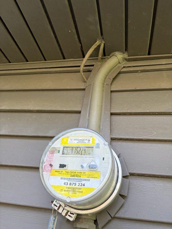 Installed dedicated electrical circuit for new HVAC system, running 8-12 gauge wiring approximately 25-30 feet through attic space to exterior meter location. Routed gray electrical conduit from meter housing along exterior siding, securing all connections per code requirements. Verified proper meter integration and completed installation with all components functioning correctly.