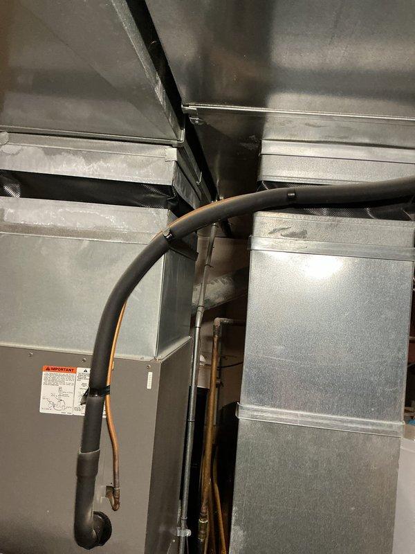 Installed AprilAire 600M humidifier unit on existing ductwork system in mechanical room. Connected unit to HVAC ductwork with proper mounting and secured all necessary plumbing and electrical connections. Verified proper operation of humidifier and integration with forced-air heating and cooling system.