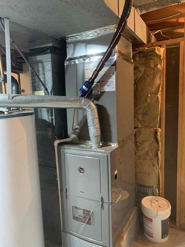 Replaced evaporator coil on ADP system in basement mechanical room. Removed failed coil, installed new unit, and verified proper operation of heating and cooling system. Customer has secondary HVAC system available for use during repair.