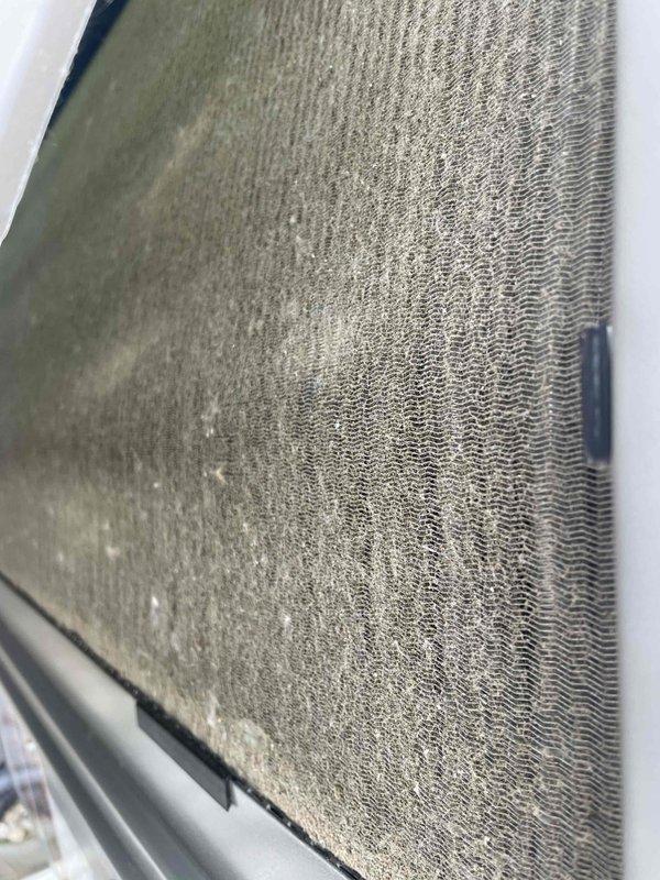Completed comprehensive tune-up service on a U10 cooling system located on the side of the home. Upon inspection, discovered heavily soiled air filter with significant dust and debris accumulation, which was affecting airflow and system efficiency. Additionally, found evaporator coil extensively covered with dirt, dust, and contaminants that had matted between the fins, severely restricting heat transfer capacity. Performed standard maintenance procedures including system inspection, cleaning, and operational testing to restore unit to proper working condition.