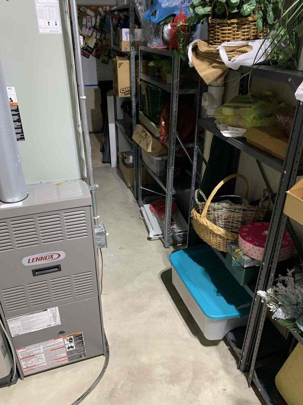Responded to no-cooling complaint on single HVAC system. Upon arrival, found Trane thermostat displaying 84°F actual temperature while set to 78°F cooling mode, indicating system was not maintaining setpoint. Verified thermostat had power and was properly configured in cooling mode with scheduled programming active. Inspected Lennox furnace/air handler unit located in basement utility area and confirmed proper installation and accessibility. Troubleshot thermostat communication and system operation to restore cooling functionality.