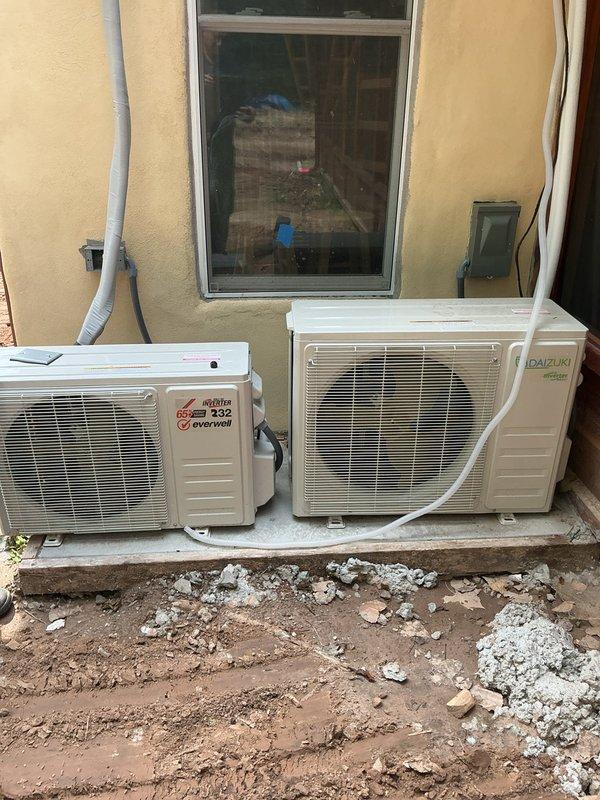 Responded to no cooling complaint on multiple mini-split systems following previous contractor's incomplete work. Performed diagnostic evaluation on four mini-split units including outdoor Daikin inverter condensers and associated indoor air handlers. Inspected refrigerant line sets, electrical connections, condensate drainage, and control wiring on all units to identify installation deficiencies and operational failures. Documented existing conditions with photographic evidence showing outdoor equipment placement, electrical disconnects, and refrigerant piping installation. Assessed system performance issues and provided recommendations for necessary repairs to restore proper cooling operation to all affected zones.