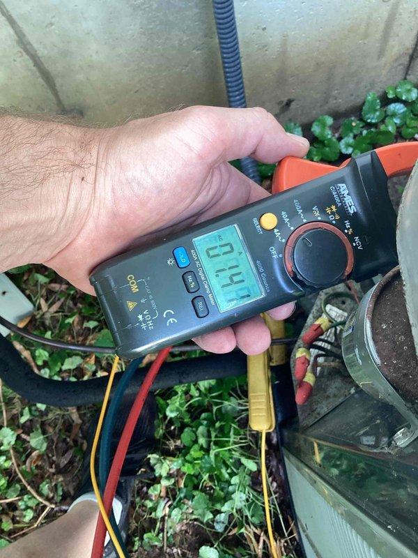 Completed comprehensive cooling maintenance on a 15-year-old residential air conditioning system. Performed standard AC tune-up protocol including inspection of indoor furnace unit and outdoor condensing unit. Utilized digital multimeter to verify electrical readings and system performance, measuring voltage and amperage at the outdoor unit to ensure proper compressor operation. Inspected all electrical connections, refrigerant lines, and condensate drainage. System tested and confirmed operational with all components functioning within normal parameters upon completion of maintenance service.