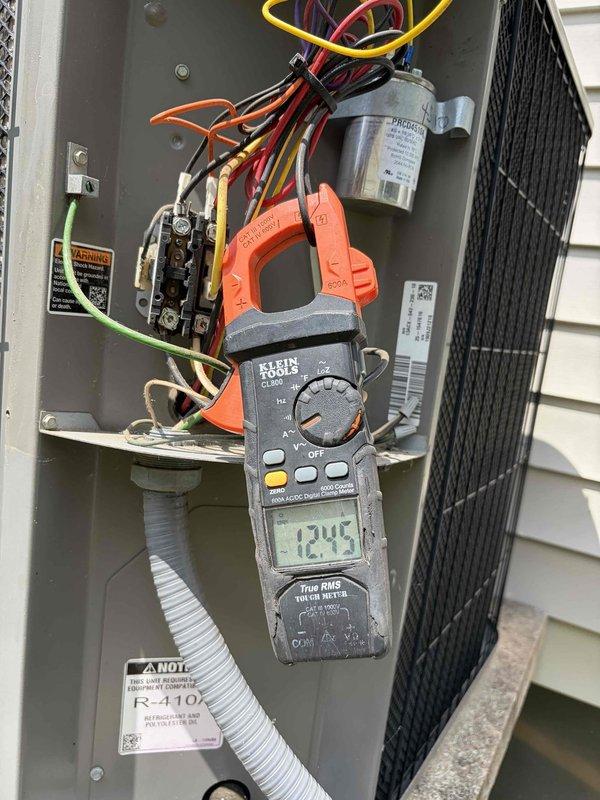 Responded to no cooling complaint on 16-year-old Lennox system where customer reported hearing a loud bang the previous night. Upon inspection, found failed dual-run capacitor with visible damage. Verified amperage readings using clamp meter and replaced defective capacitor with new PROTECH unit, restoring proper operation to both compressor and condenser fan motor.
