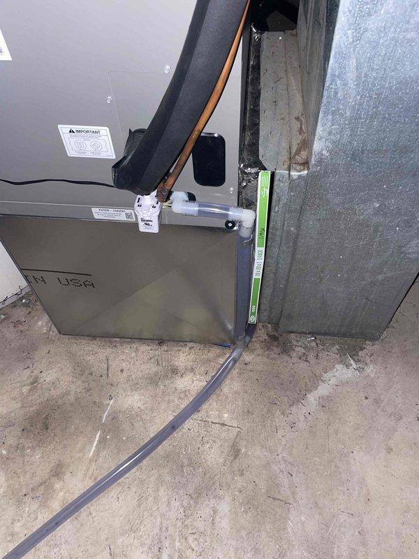Responded to callback for new heat pump installation reported not cooling. Upon arrival, accessed property through garage door and completed system startup and verification. System found to be operational; confirmed proper heat pump operation, thermostat functionality, and electrical connections. Documented installed equipment including air handler with 15 KW heat kit, non-programmable heat pump thermostat, new disconnect and whip, and verified all components functioning as designed.