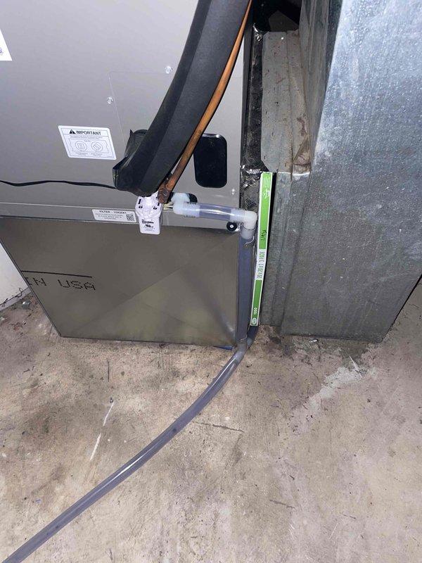 Responded to callback for new heat pump installation reported not cooling. Upon arrival, accessed property through garage door and completed system startup and verification. System found to be operational; confirmed proper heat pump operation, thermostat functionality, and electrical connections. Documented installed equipment including air handler with 15 KW heat kit, non-programmable heat pump thermostat, new disconnect and whip, and verified all components functioning as designed.