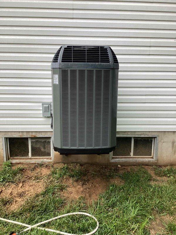 Responded to no cooling complaint on 8-year-old residential outdoor unit. Upon arrival, performed diagnostic inspection of condenser system and verified clearance measurements between unit and building exterior, confirming adequate airflow spacing per manufacturer specifications. Documented equipment condition and installation positioning with photographic evidence showing unit mounted on foundation with proper electrical disconnect present. System evaluated for cooling operation and common failure points associated with no-cool conditions on units of this age.