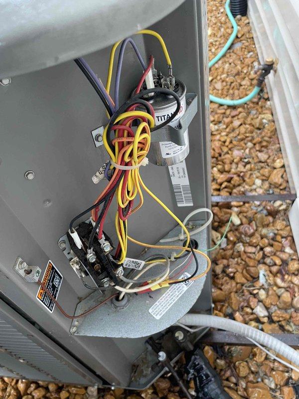 Completed comprehensive cooling maintenance on two 13-year-old air conditioning systems. Performed standard tune-up procedures including inspection of electrical connections and control components in outdoor junction box with TITAN capacitor, verified proper operation of condenser units, cleaned and serviced both systems to manufacturer specifications. Both units tested and confirmed operational with no deficiencies noted.