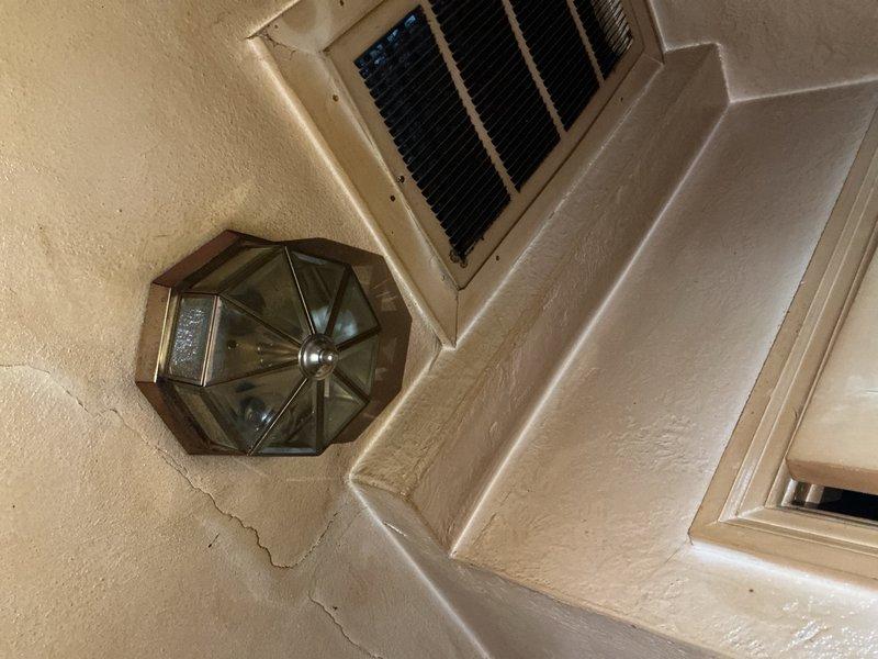 Installed two customer-provided light fixtures at the property: a circular wall sconce with frosted glass cover in an interior living space, and an octagonal bronze-toned outdoor lantern with amber glass panels at the building's exterior entrance. Both fixtures were mounted securely to textured wall surfaces, wired to existing electrical circuits, tested for proper operation, and confirmed to be functioning correctly upon completion.