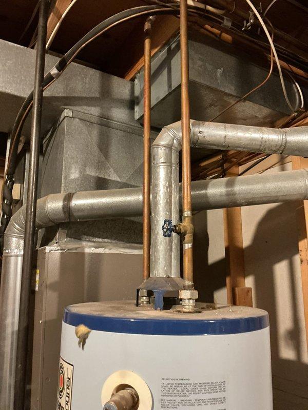 Installed a 40-gallon tall propane-fired water heater in basement utility area. Connected copper supply lines with shut-off valves, established proper venting through existing ductwork system, and verified all connections for safe operation. Unit was installed adjacent to existing HVAC system with appropriate clearances maintained per manufacturer specifications and local code requirements.