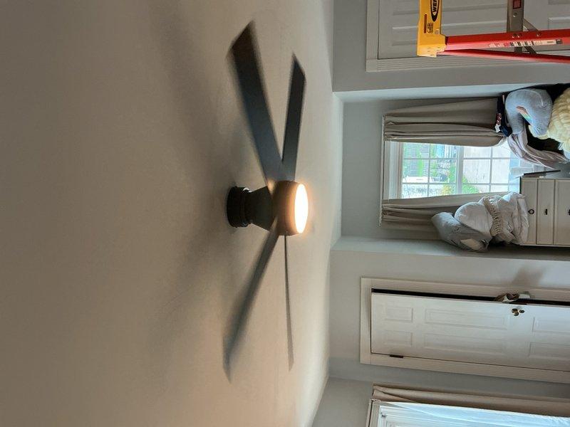 Completed installation of three ceiling fan-rated electrical boxes and wall-mounted light fixtures throughout residential hallway and adjacent room. All fixtures installed per code with proper mounting hardware, tested for operation, and confirmed illumination quality meets specification.