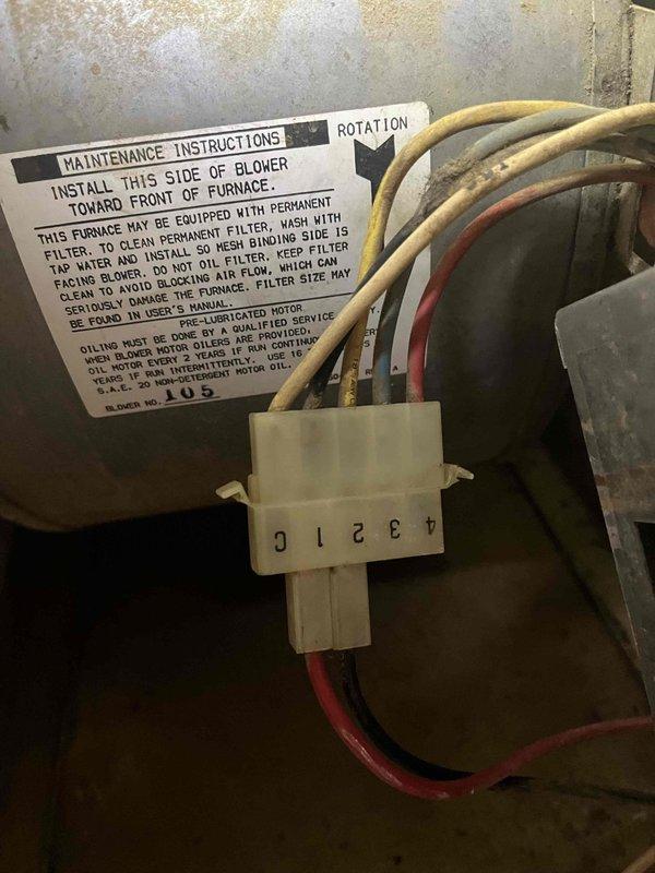 # HVAC Service - No Cool Call

Responded to no cooling complaint on 10+ year old AC unit located at side of home. Upon arrival, confirmed unit was shut down due to suspected blower motor failure. Performed diagnostic testing on blower motor assembly using multimeter to verify electrical continuity and motor functionality. Inspected blower housing, motor connections, and wiring harness for signs of failure or damage. Motor showed signs of age with significant dust accumulation on housing and internal components. Tested electrical connections at motor terminals and verified proper voltage supply to unit. Documented existing condition of blower motor assembly and electrical connections with photos for service records. Provided customer with diagnostic findings and repair recommendations to restore cooling operation.