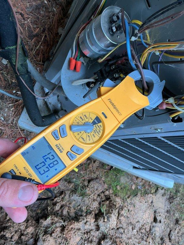 Responded to callback for outdoor condenser unit making metal-on-metal noise with indoor unit communication fault. Upon arrival, performed electrical diagnostics on 10-year-old ground-level system using clamp meter and multimeter to test capacitor, compressor windings, and control board connections. Verified proper voltage and amperage readings at contactor and capacitor terminals. Inspected condenser fan motor and blade assembly for mechanical interference causing reported metallic sound. Tested communication wiring between indoor air handler and outdoor condensing unit to diagnose fault code. System evaluated and electrical components tested to identify source of communication failure and mechanical noise concern.