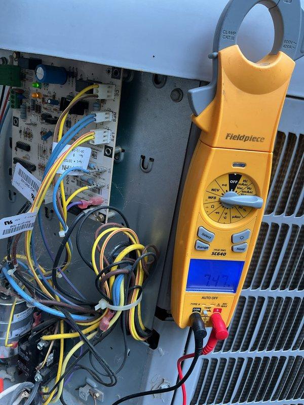 Responded to callback for outdoor condenser unit making metal-on-metal noise with indoor unit communication fault. Upon arrival, performed electrical diagnostics on 10-year-old ground-level system using clamp meter and multimeter to test capacitor, compressor windings, and control board connections. Verified proper voltage and amperage readings at contactor and capacitor terminals. Inspected condenser fan motor and blade assembly for mechanical interference causing reported metallic sound. Tested communication wiring between indoor air handler and outdoor condensing unit to diagnose fault code. System evaluated and electrical components tested to identify source of communication failure and mechanical noise concern.