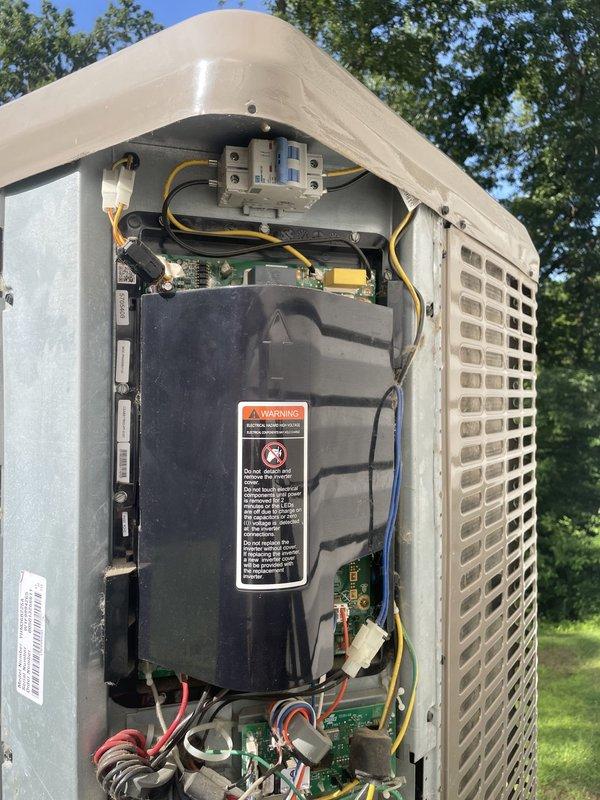 Responded to no cooling complaint on upper floor for two-unit system. Inspected outdoor condensing unit U10 and found unit operational with all electrical connections secure and compressor functioning properly. Verified thermostat display showing 79°F actual temperature with setpoint at 74°F, indicating system was running but not achieving desired cooling. Advised customer of findings and recommended system shutdown pending further diagnostics.