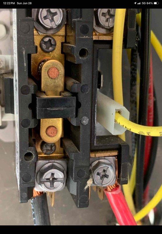 Responded to no cooling call on 2-year-old system experiencing repeated freeze-up conditions. Upon arrival, unit had been shut down per instructions with thermostat set to fan only mode. Performed diagnostic inspection revealing corrosion and oxidation present on electrical terminal connections and mechanical components. Documented electrical terminal block condition showing rust formation on brass contacts and mounting hardware, as well as corrosion on internal mechanical assembly near spring mechanism. Verified warranty coverage status on recently installed 2024 equipment and photographed affected components for documentation purposes.