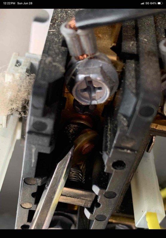 Responded to no cooling call on 2-year-old system experiencing repeated freeze-up conditions. Upon arrival, unit had been shut down per instructions with thermostat set to fan only mode. Performed diagnostic inspection revealing corrosion and oxidation present on electrical terminal connections and mechanical components. Documented electrical terminal block condition showing rust formation on brass contacts and mounting hardware, as well as corrosion on internal mechanical assembly near spring mechanism. Verified warranty coverage status on recently installed 2024 equipment and photographed affected components for documentation purposes.