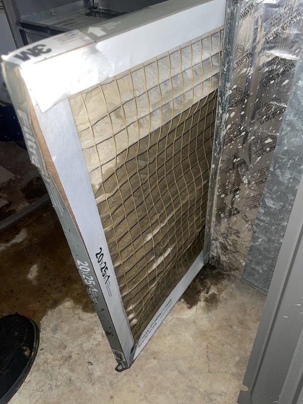 Responded to no-cool call on a Lennox system less than two years old. Upon arrival, confirmed unit was not operating and customer reported previous freeze-up incident with belief system needed refrigerant recharge. Performed diagnostic evaluation of outdoor unit, inspecting compressor, condenser fan motor, and electrical connections. Documented condition of condenser coil and fan assembly with photographs showing normal appearance of components. 

Proceeded to indoor air handler for comprehensive system assessment. Removed and inspected air filter, which showed significant dirt and debris accumulation with heavy discoloration throughout pleated media. Documented severely restricted airflow condition caused by clogged filter. Dirty filter was identified as primary cause of previous freeze-up and current system failure, as reduced airflow across evaporator coil leads to excessive temperature drop and ice formation on coil surfaces, triggering safety shutdowns.

Explained to customer that