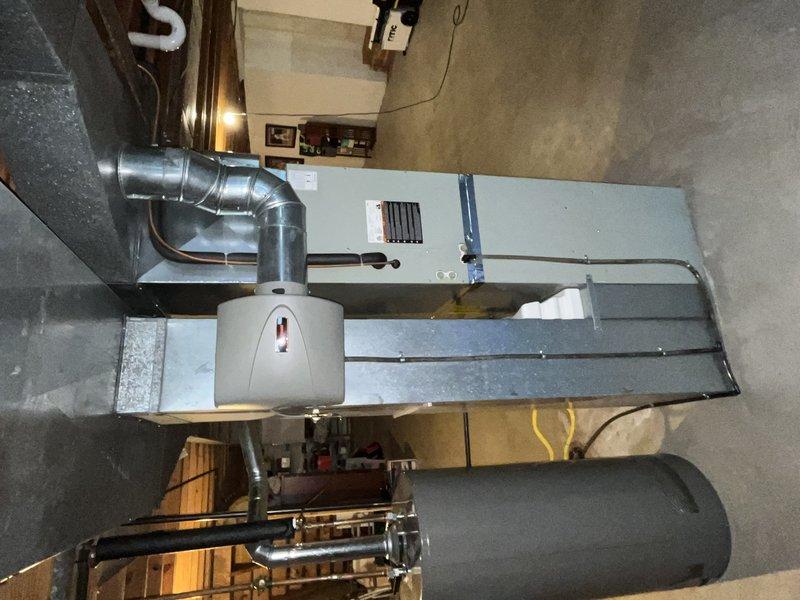 # HVAC Service - No Cool Diagnostic

Responded to service call for 8-year-old air handler system located in basement with reported issues of warm air discharge, inadequate temperature maintenance, and excessive operational noise. Upon arrival, customer had system running in fan-only mode with cooling disabled per pre-service instructions.

Performed comprehensive diagnostic evaluation of the air handling unit and associated ductwork. Conducted visual inspection of the entire HVAC installation including the air handler cabinet, supply plenum connections, and metallic ductwork configuration. Examined control panel indicators and operational status lights on unit front panel. Assessed humidifier integration and connection points to main supply duct.

Evaluated airflow characteristics through supply grilles and return air pathways. Inspected ductwork joints, elbow connections, and insulation integrity throughout the distribution system. Checked for proper clearances around equipment and ve